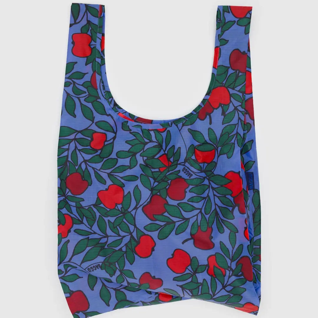 Reusable bag with red apple pattern on a blue background