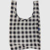 Black and white checkered reusable bag on a light gray background