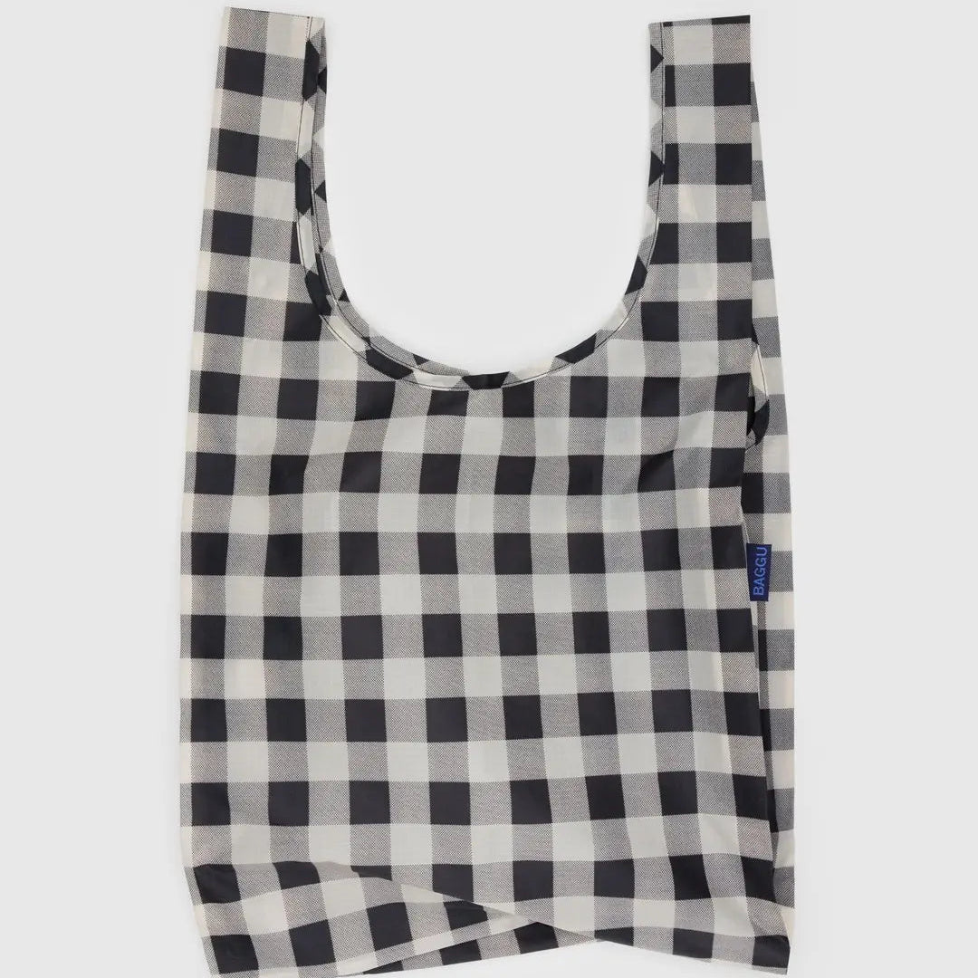 Black and white checkered reusable bag on a light gray background