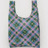 Reusable bag with green and purple plaid pattern on a white background