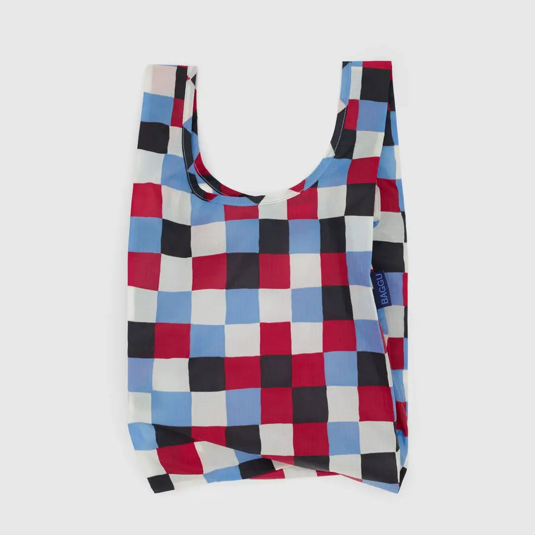 Checkered reusable bag with red, blue, and black pattern on a white background